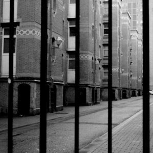 This photo does not show a real prison, it is a shot taken in the Marolles, a well-known district in Brussels, which unfortunately has not such a good reputation for some time. Years ago when this photo was taken (somewhere in 2015) you could still walk around with a camera over there, Today you would probably have be robbed very quickly, because the streets are now full of youth rascals, gangs and drug users.