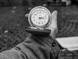 Thirteen past three A photo of a man holding an alarm clock he found on the street after a flea market. It was then effectively thirteen minutes past three, that clock still worked.