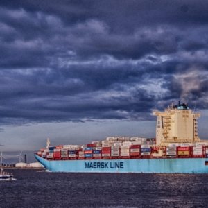 This photo shows a container ship leaving the port of Antwerp. The original photo was converted to HDR afterwards.